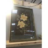 A gilt framed fabric pictures of flowers