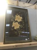 A gilt framed fabric pictures of flowers