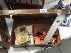A small leather suitcase and contents