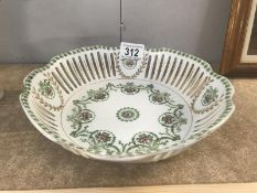 A continental porcelain bowl with pierced sides