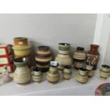 12 German pottery vases including complementary set of 8.