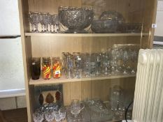 3 shelves of drinking glasses, vases,