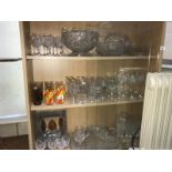 3 shelves of drinking glasses, vases,