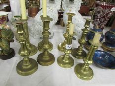 4 pairs of Victorian brass candlesticks.