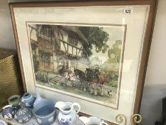 A large framed and glazed print of Tudor cottage and horses