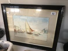 A framed and glazed watercolour of a seascape