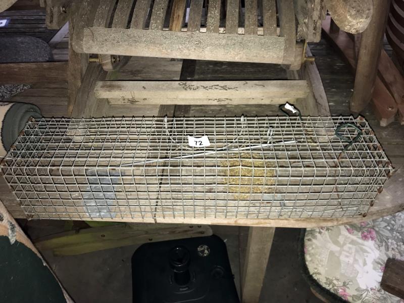 A large wire mesh humane rodent trap