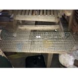 A large wire mesh humane rodent trap