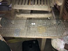 A large wire mesh humane rodent trap