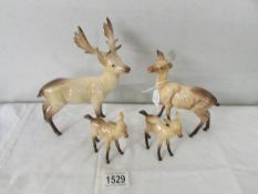 A Beswick Stag, a Beswick Doe and 2 Beswick deer foals.