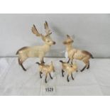 A Beswick Stag, a Beswick Doe and 2 Beswick deer foals.