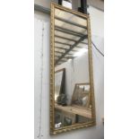 A gilt framed mirror