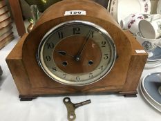 A 1930's oak mantle clock