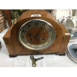 A 1930's oak mantle clock