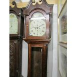 An oak 8 day painted dial long case clock marked A Dunne, Bradford.