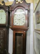 An oak 8 day painted dial long case clock marked A Dunne, Bradford.