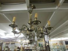 A brass 6 lamp ceiling light.