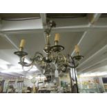 A brass 6 lamp ceiling light.