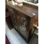 A 1930'S oak display cabinet