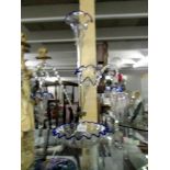 A glass epergne with 2 hanging baskets.