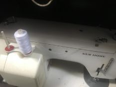 A cased New Home sewing machine