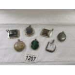 7 assorted stone set silver pendants including moss agate etc.