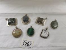 7 assorted stone set silver pendants including moss agate etc.