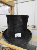 A good quality Henry Heath top hat. approximate size 6 7/8ins.