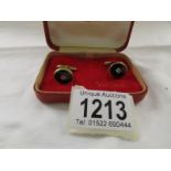 A pair of 9ct (375) gold cuff links with centre diamond, hall marked London 1965, 7.52 grams.