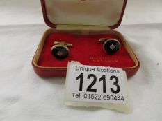 A pair of 9ct (375) gold cuff links with centre diamond, hall marked London 1965, 7.52 grams.