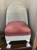 A lloyd loom bedroom chair with spring seat