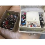 A cream jewellery box with miscellaneous jewellery and one further box with jewellery