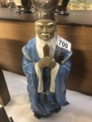 A pottery Chinese deity figure