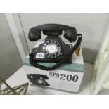 A boxed G.P.O retro style dial telephone.