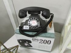 A boxed G.P.O retro style dial telephone.