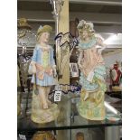 2 bisque porcelain figures.