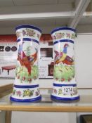 A pair of fine continental porcelain vases decorated with birds.
