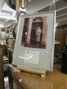 A framed and glazed photograph of Margaret Thatcher with signature.