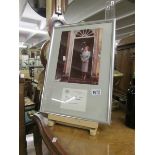 A framed and glazed photograph of Margaret Thatcher with signature.