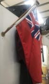 A vintage motor launch/boat flag & mast