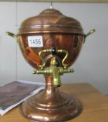 A copper samovar urn with brass tap and handles.