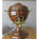 A copper samovar urn with brass tap and handles.