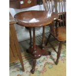 A carved mahogany table with shaped top;