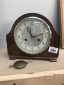 An Edwardian oak mantel clock