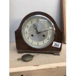 An Edwardian oak mantel clock