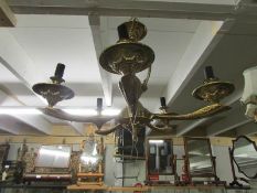 A gilded 5 lamp ceiling light.