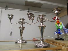 A pair of good quality silver plate candelabra.