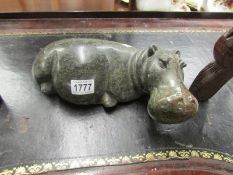 A carved stone hippo.