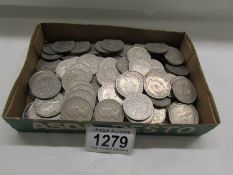 A large quantity of 2/- pieces.