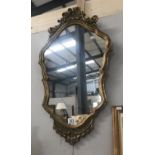 A gilt framed mirror